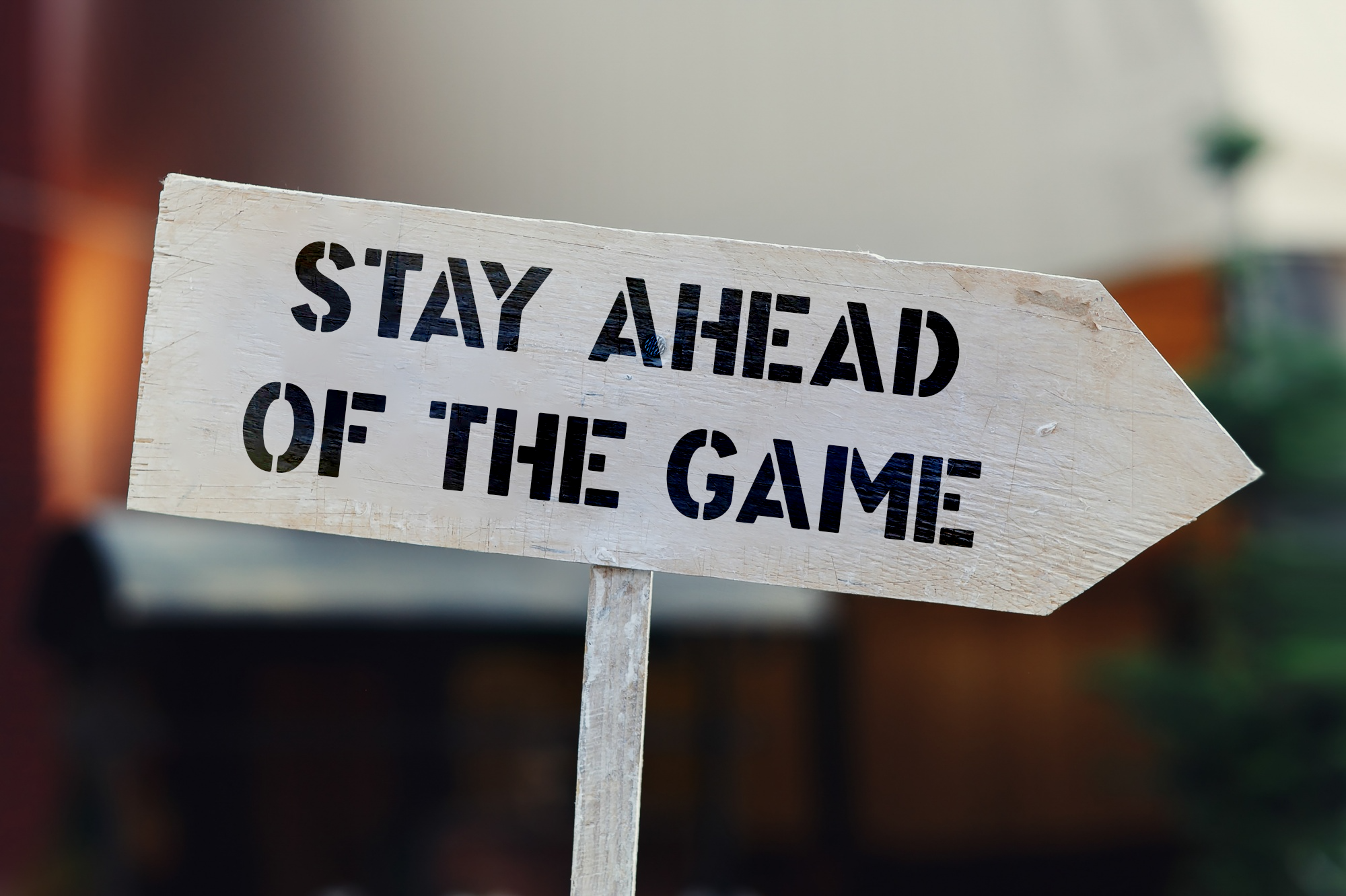 An image of a sign with the text "stay ahead of the game"